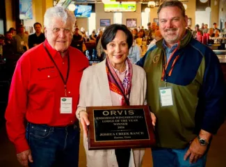 Group photo with the 2026 Orvis Endorsed Lodge of the Year plaque